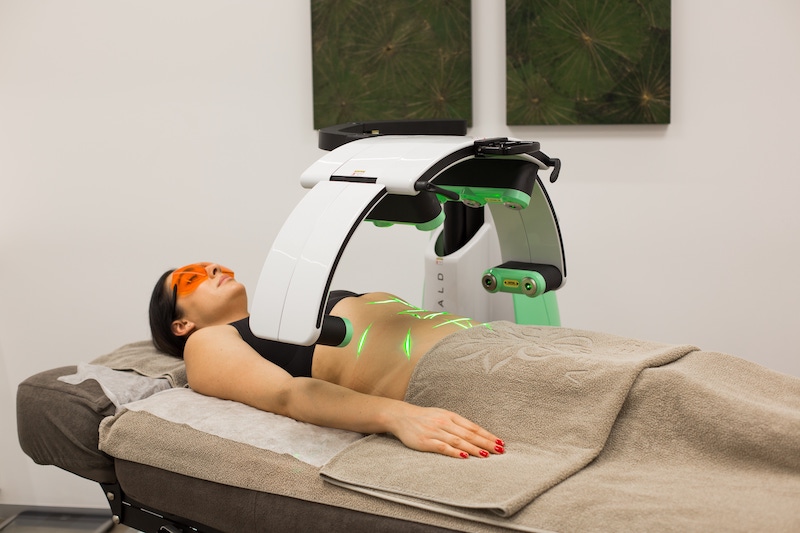 Emerald Laser in action over a patient in clinic